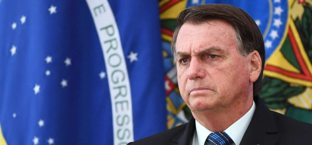(FILES) In this file photo taken on February 5, 2021 Brazilian President Jair Bolsonaro gestures as he speaks during a press conference on a new fuel tax policy at Planalto Palace in Brasilia. Brazils